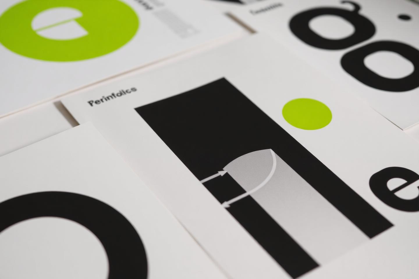 Printed brand guideline pages laid out on a table
